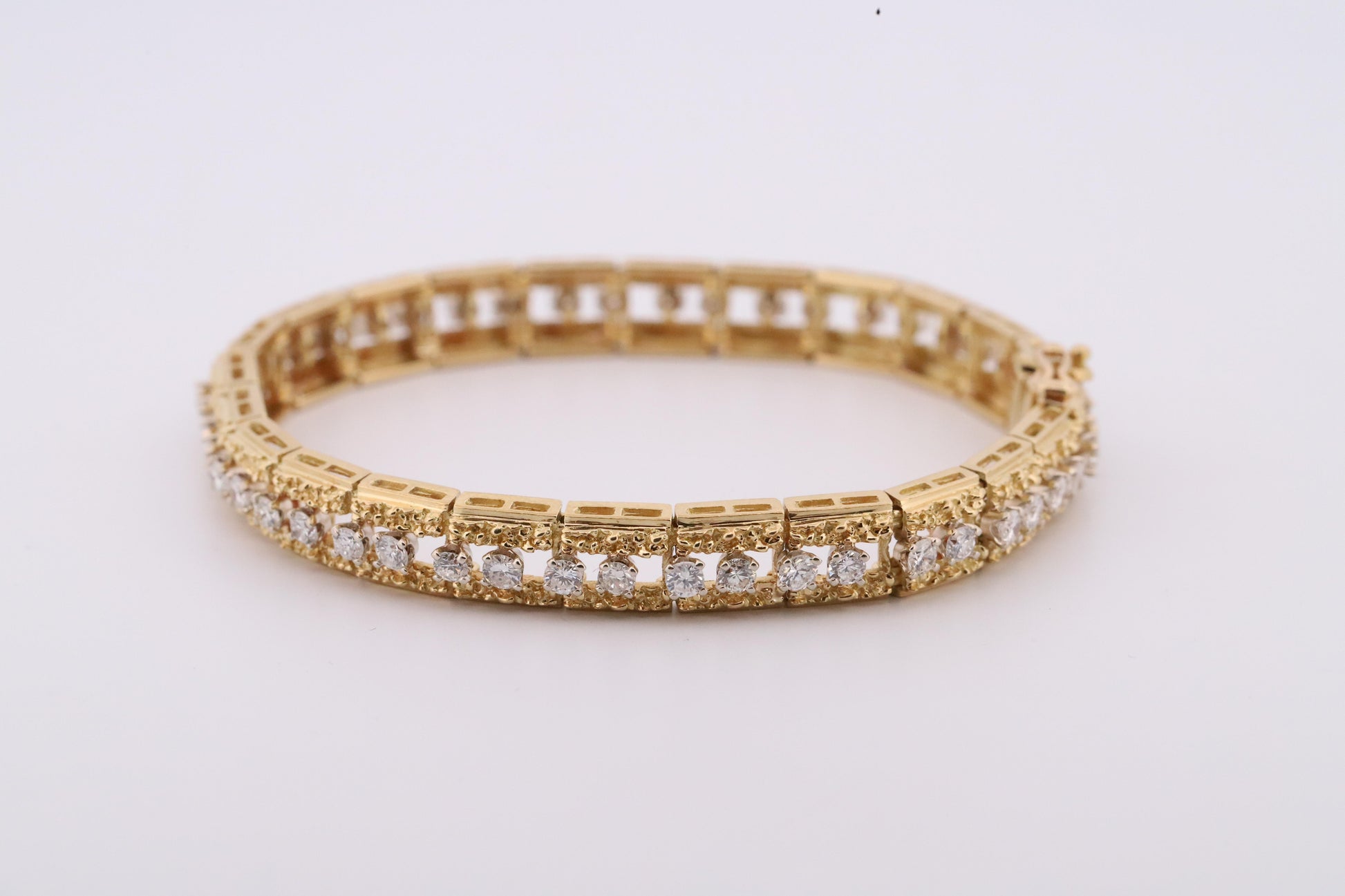 Intricately Designed 18K Vintage Diamond Tennis Bracelet by Hammerman Brothers