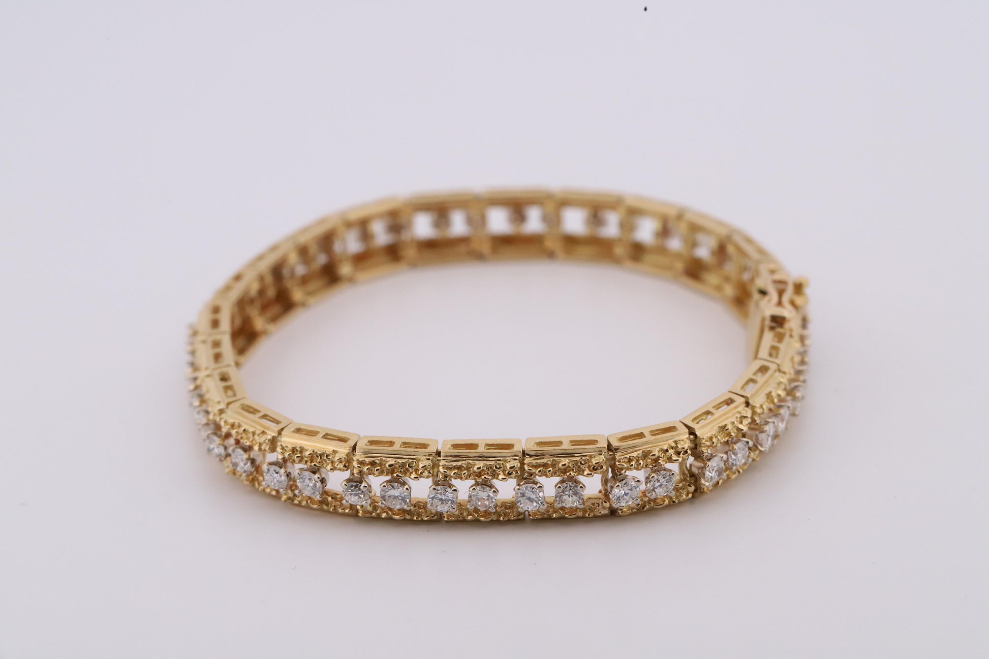 Intricately Designed 18K Vintage Diamond Tennis Bracelet by Hammerman Brothers