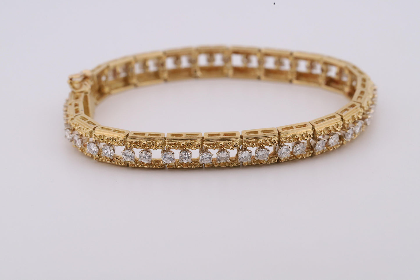 Intricately Designed 18K Vintage Diamond Tennis Bracelet by Hammerman Brothers