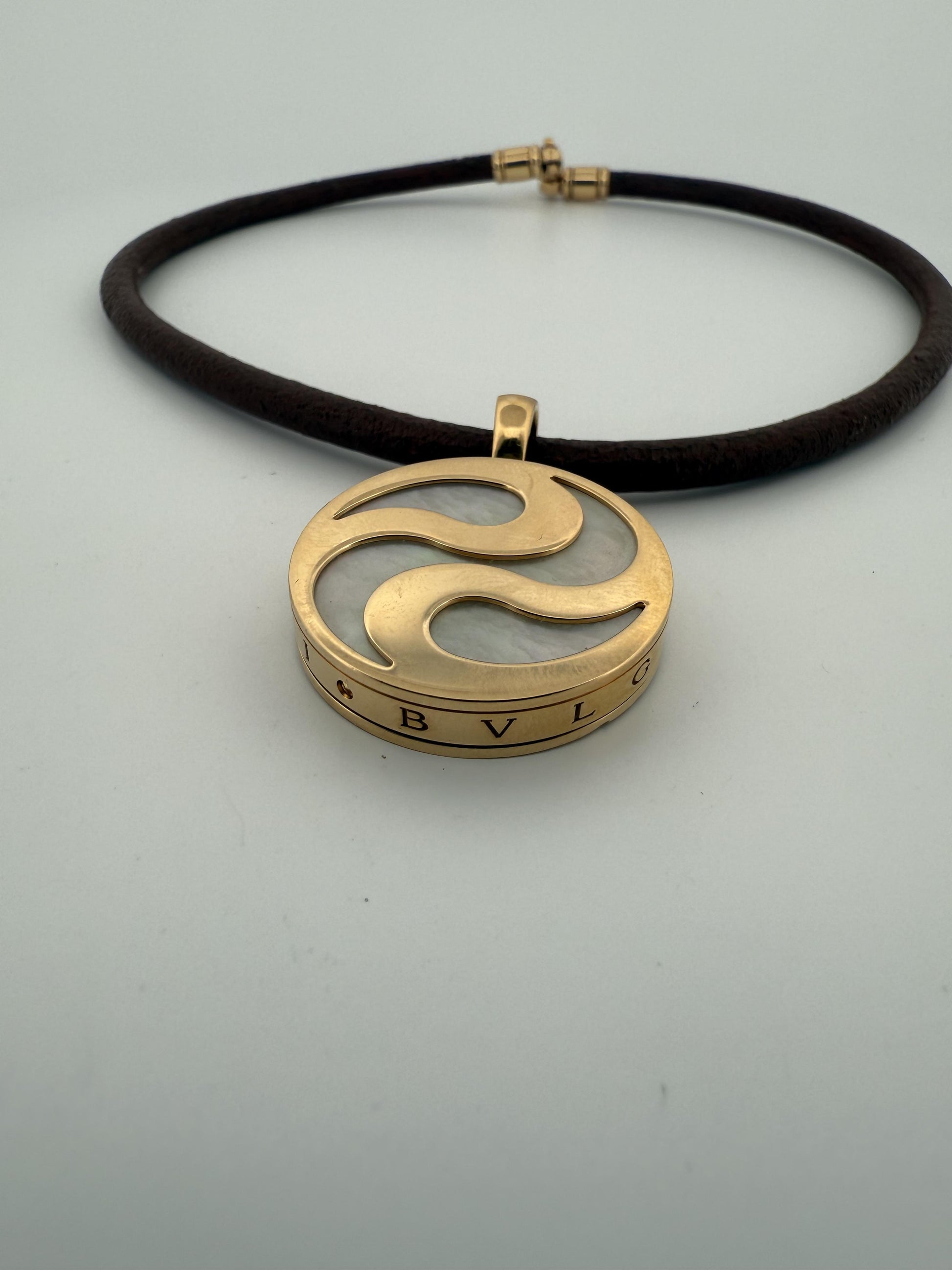 Bulgari Spinning MOP Optical Illusion Pendant w/18K and Leather Necklace