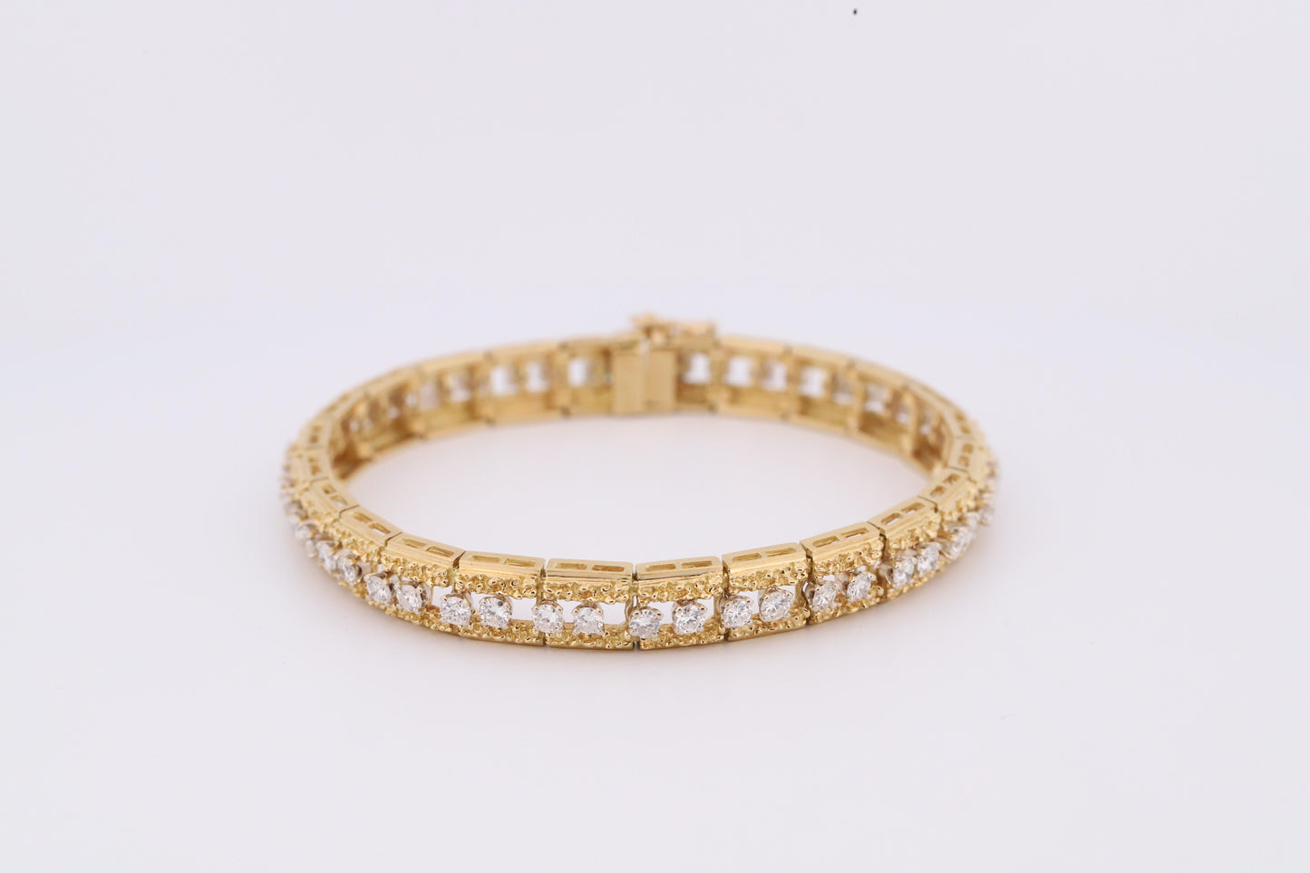 Intricately Designed 18K Vintage Diamond Tennis Bracelet by Hammerman Brothers