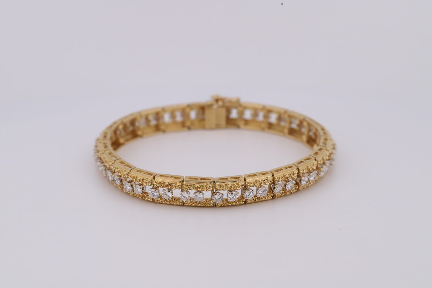 Intricately Designed 18K Vintage Diamond Tennis Bracelet by Hammerman Brothers