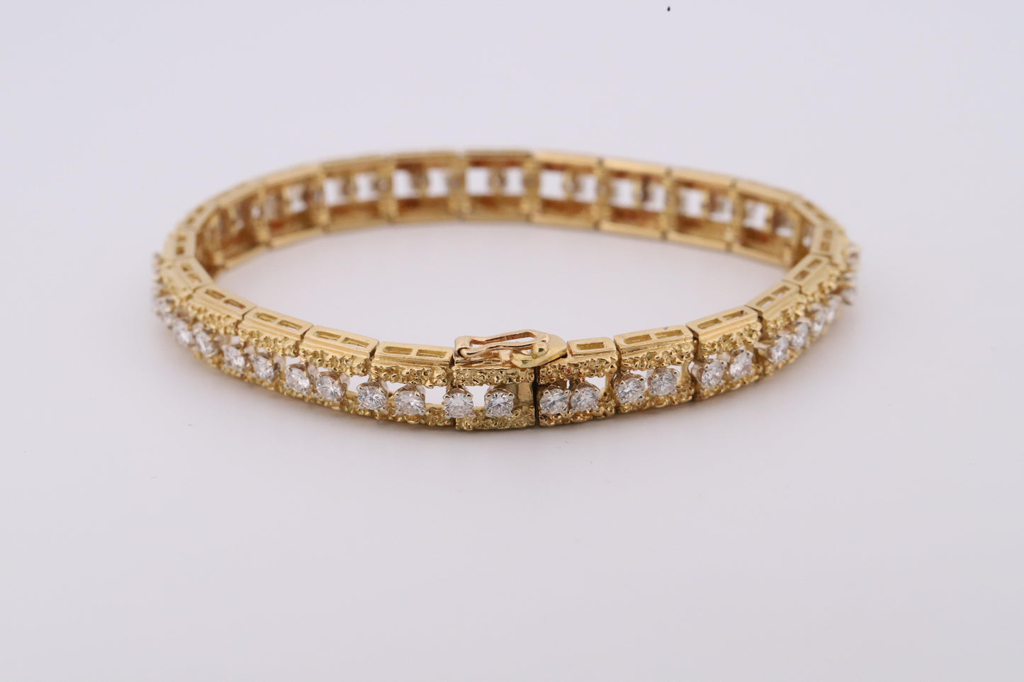 Intricately Designed 18K Vintage Diamond Tennis Bracelet by Hammerman Brothers