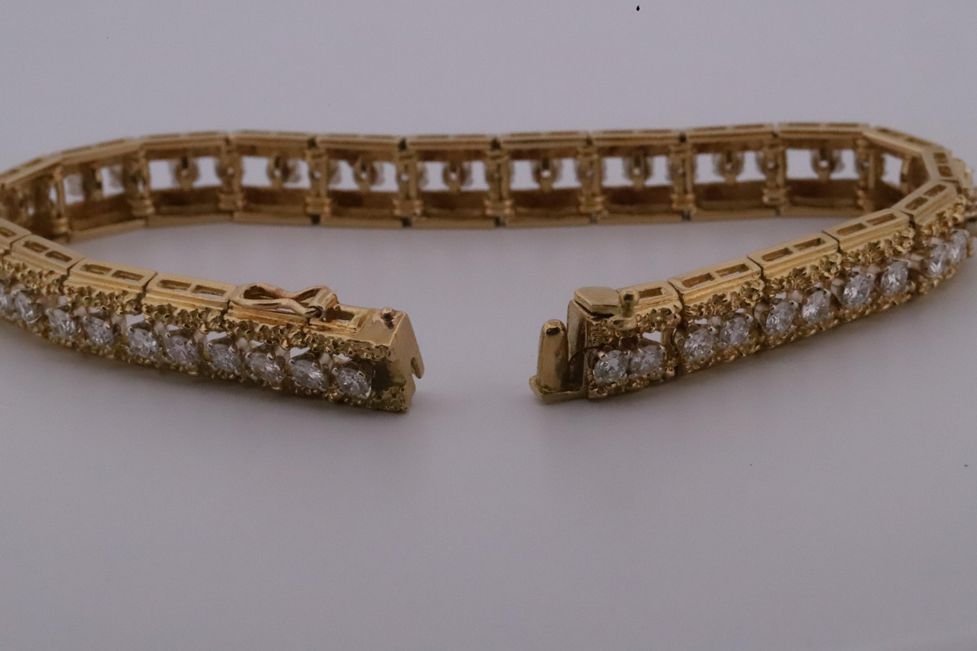 Intricately Designed 18K Vintage Diamond Tennis Bracelet by Hammerman Brothers