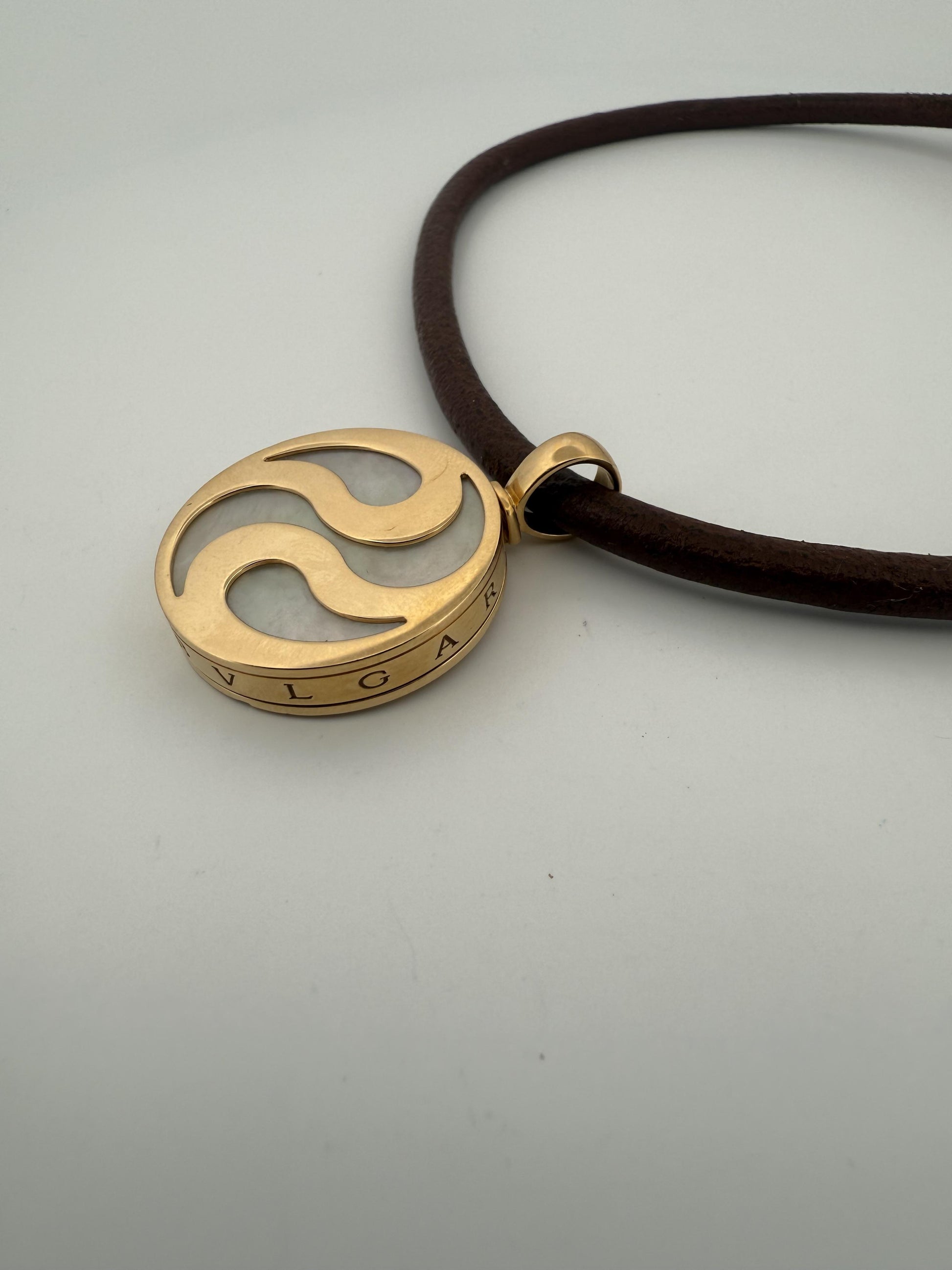 Bulgari Spinning MOP Optical Illusion Pendant w/18K and Leather Necklace